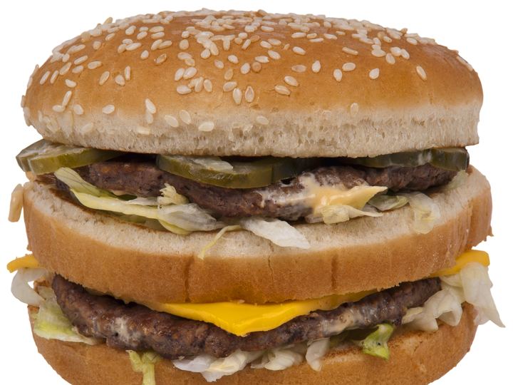 A Big Mac hamburger with three sesame bun layers