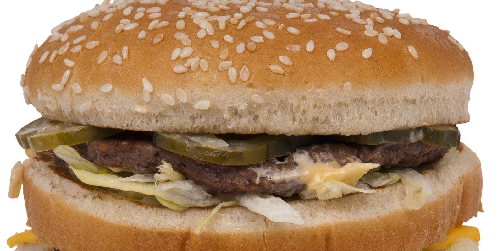 A Big Mac hamburger with three sesame bun layers