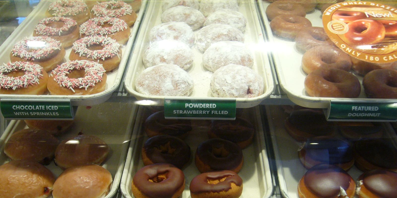 An assortment of glazed and frosted doughnuts