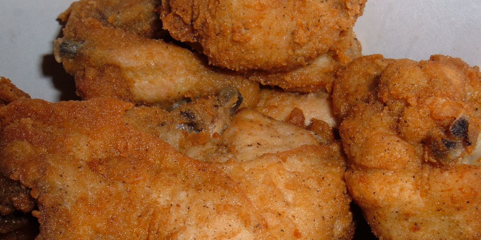 Original Recipe fried chicken pieces in a bucket